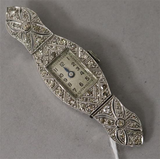 A ladys mid 20th century platinum and diamond set cocktail watch, with diamond set case and lugs (no strap).